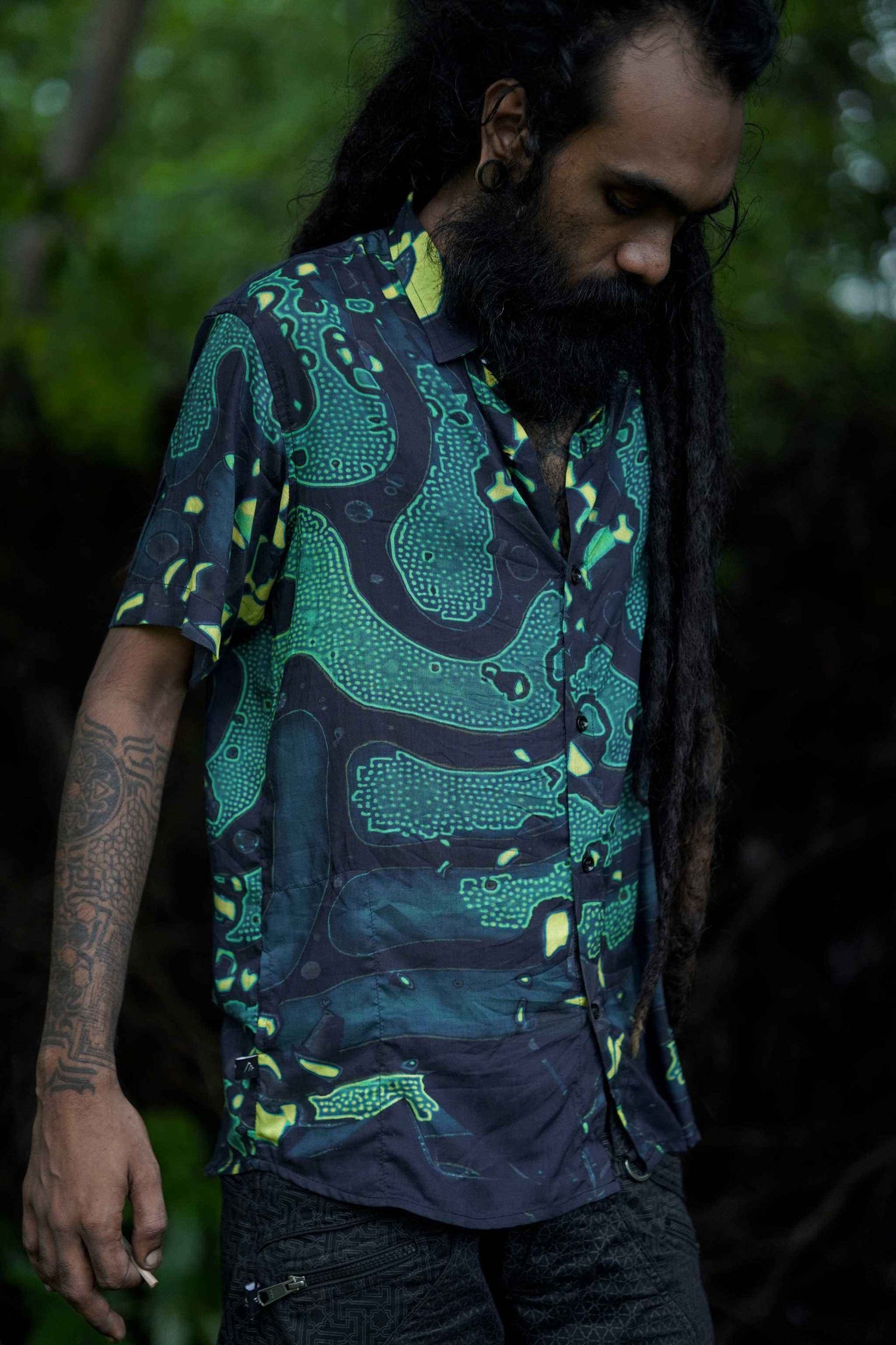 model in mens bamboo short sleeve bamboo shirts with psychedelic green print