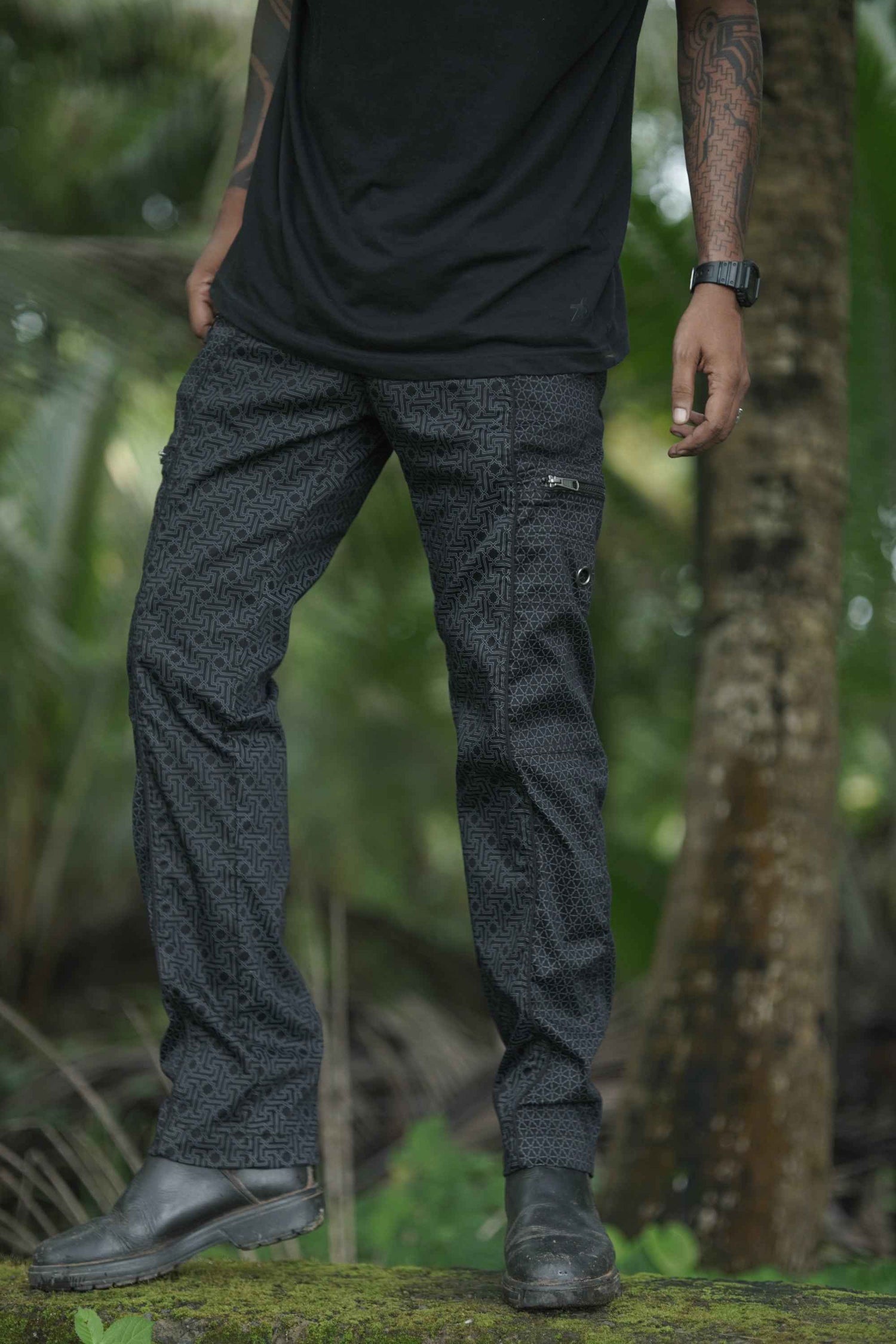 Front view of men’s stretch cargo pants in black with Shri Yantra print
