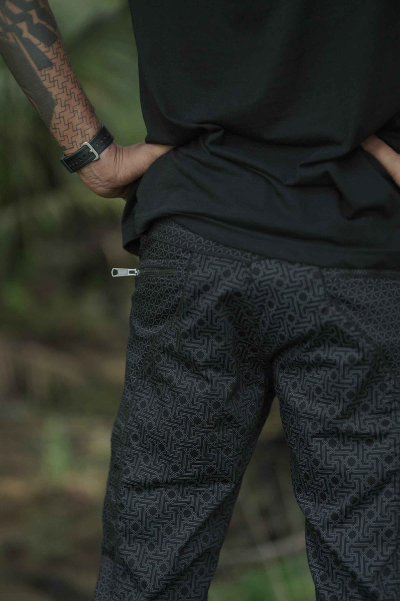 Black festival-ready utility pants for men by Walla Enterprises