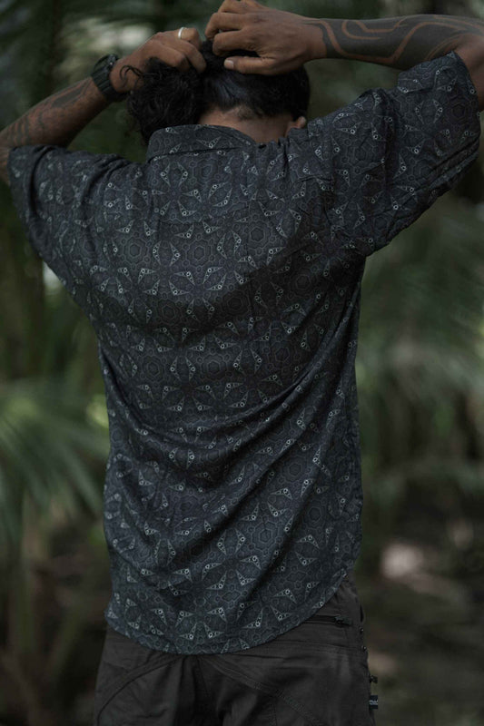 Back view of men’s bamboo short sleeve psytrance button-up shirt with all-over psychedelic print