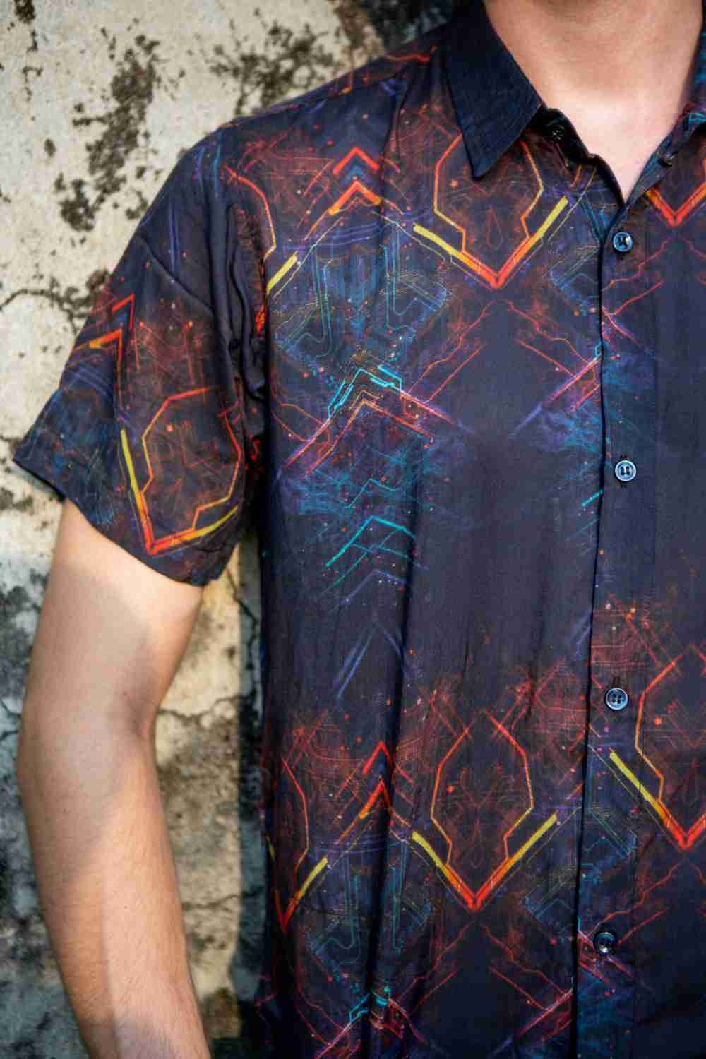 Close-up of bamboo short sleeve shirt fabric – trippy neon glitch pattern