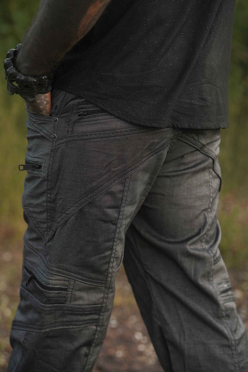 Close-up of grey glitch pattern on men's festival cargo pants