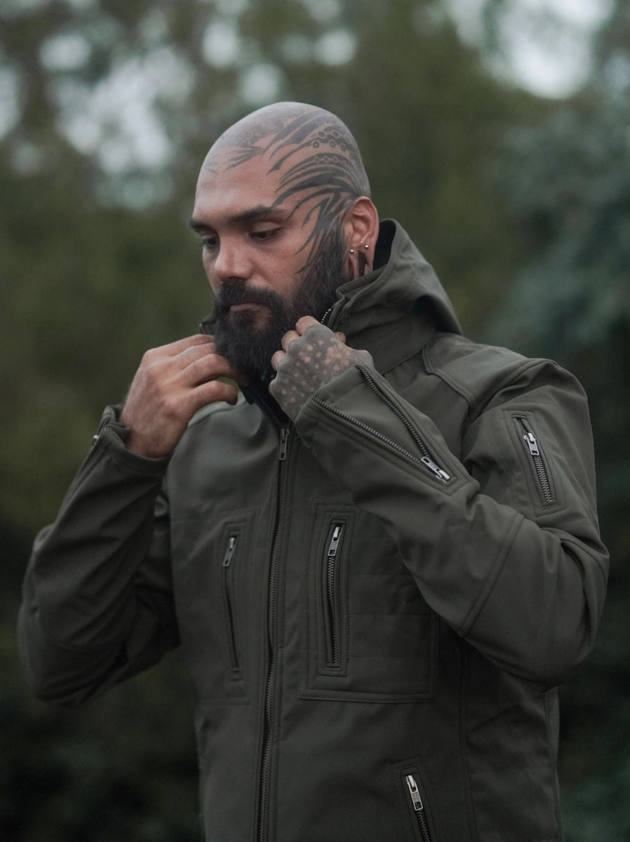 men wearing olive green festival windbreaker jacket adjusting collar softshell hooded jacket