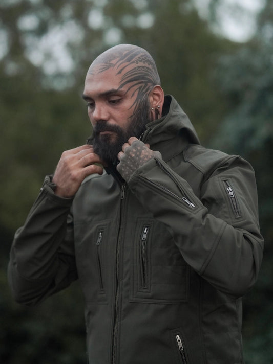 men wearing olive green festival windbreaker jacket adjusting collar softshell hooded jacket