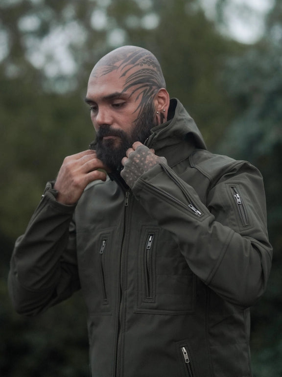 men wearing olive green festival windbreaker jacket adjusting collar softshell hooded jacket