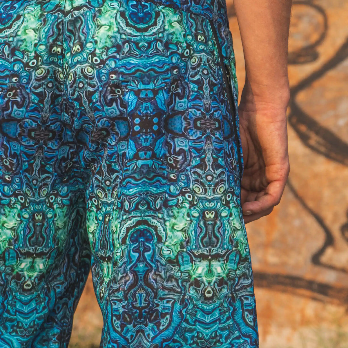 psychedelic printed swim shorts back view men