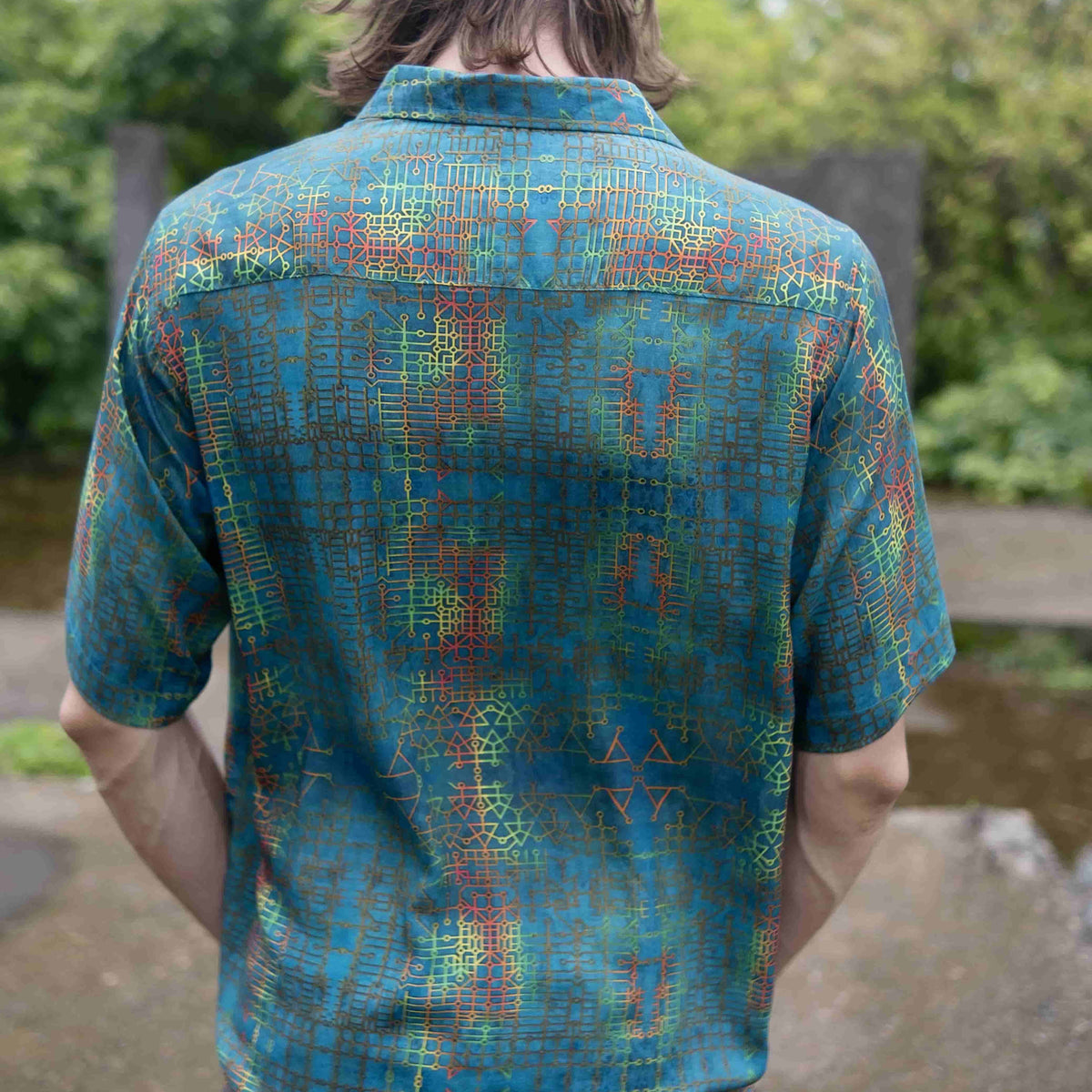 Back view of men’s bamboo lightweight summer shirt with geometric design