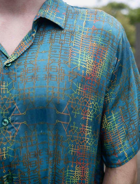Close-up of blue bamboo summer shirt showing geometric art print