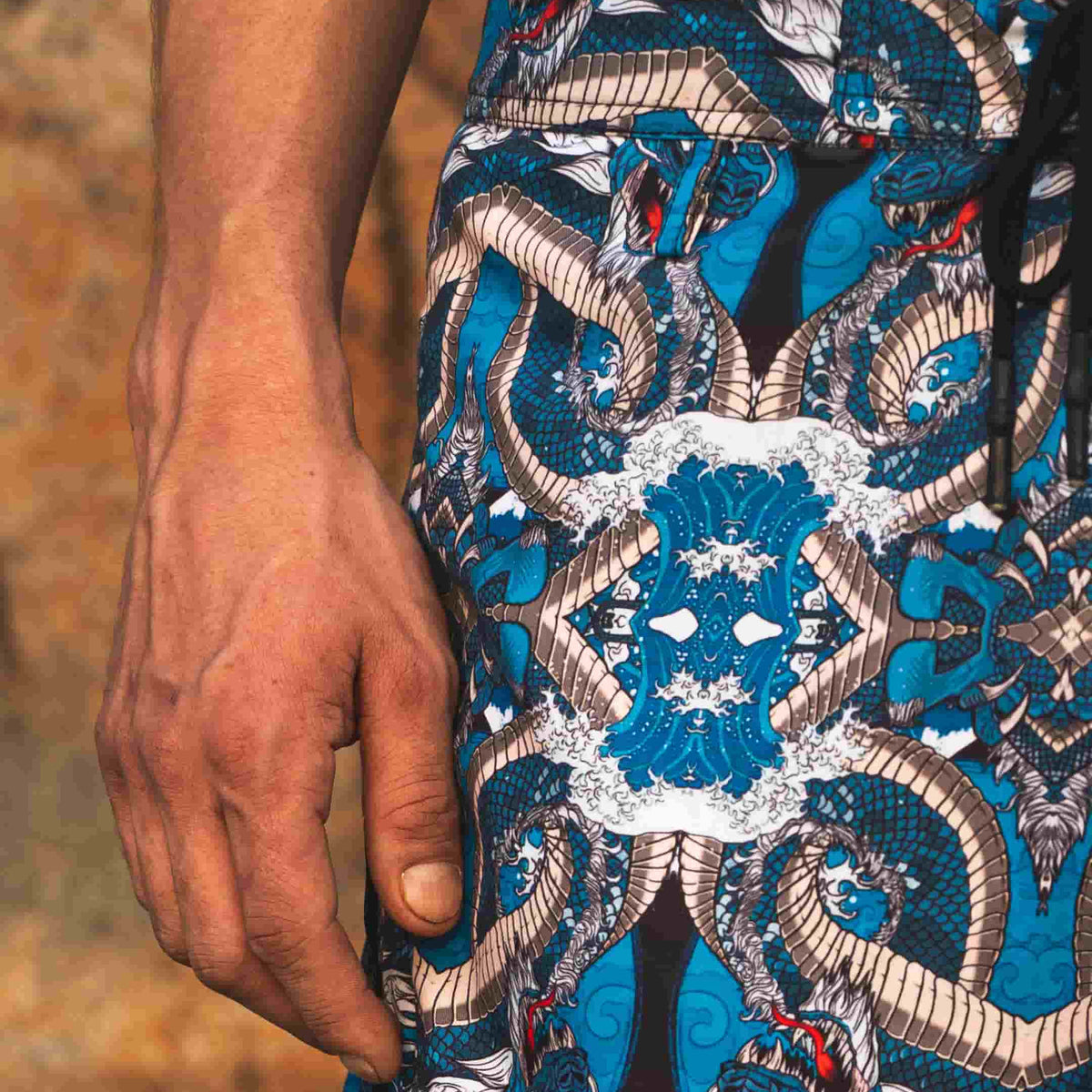 detail of blue japanese dragon printed swim shorts pattern