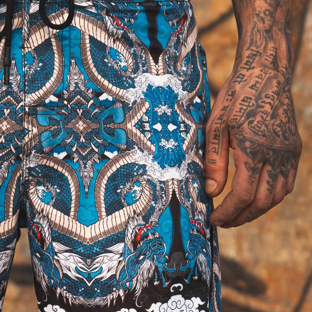 quick dry swim shorts with dragon print and drawstring waist