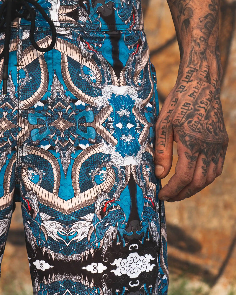 quick dry swim shorts with dragon print and drawstring waist