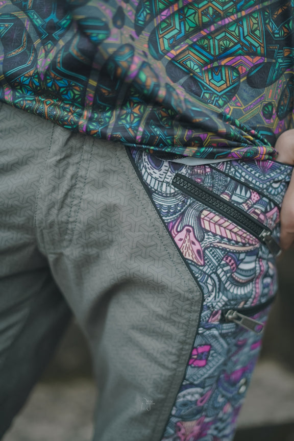 Above knee men’s cargo shorts with psychedelic print panels and secure zippered pockets