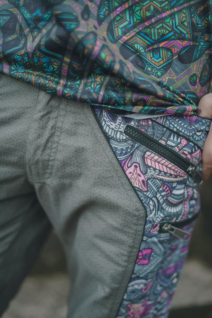 Above knee men’s cargo shorts with psychedelic print panels and secure zippered pockets
