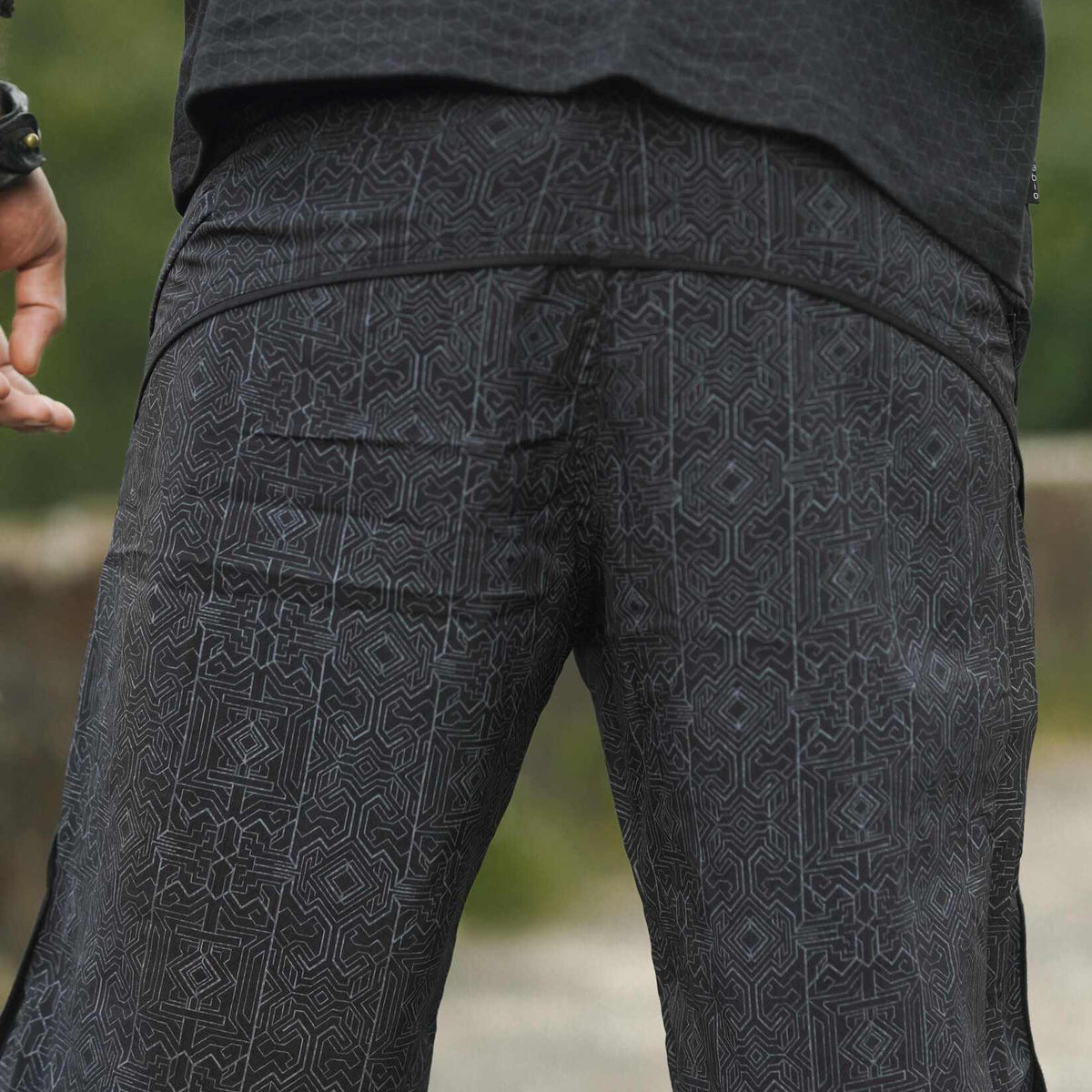 black patterned board shorts men back view