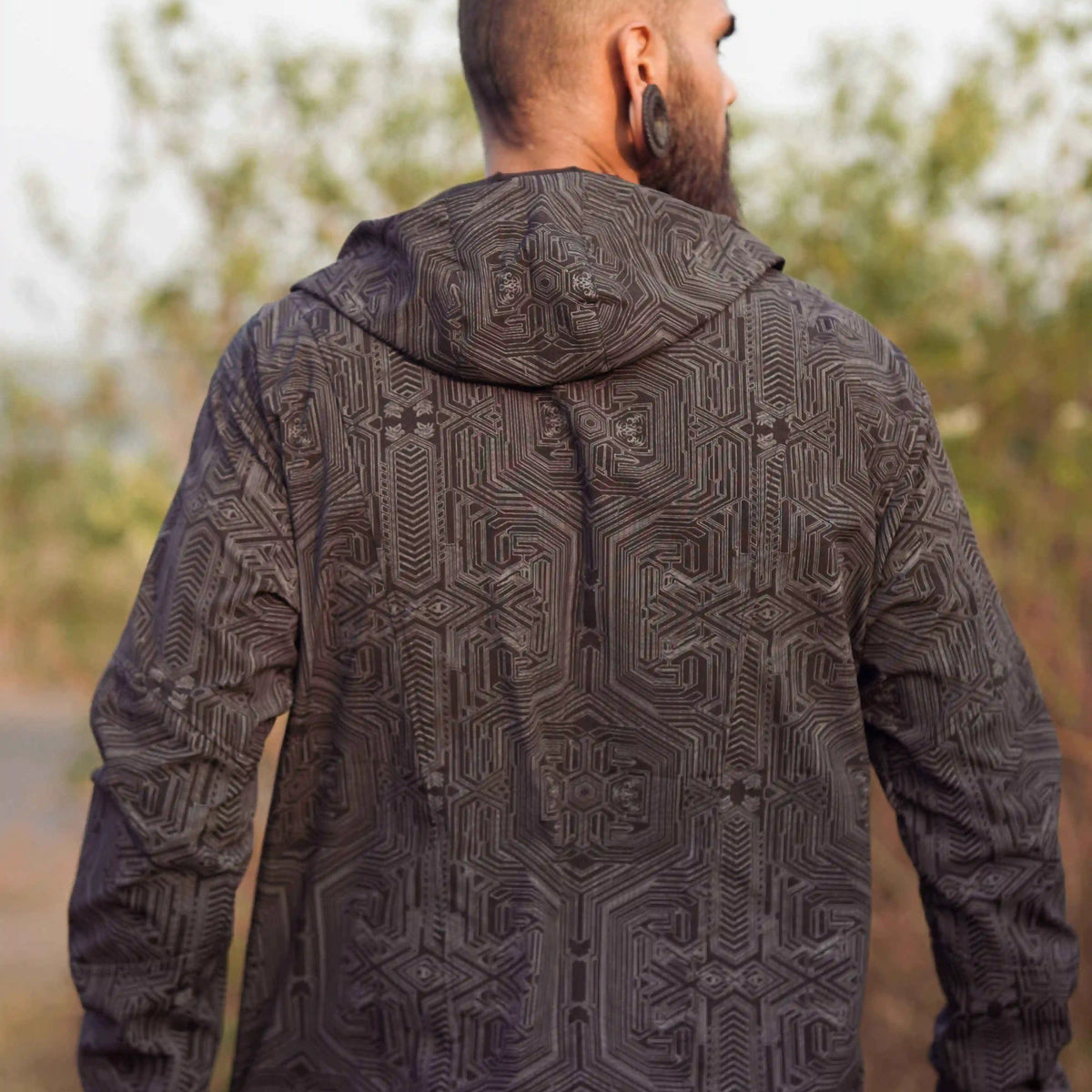 Black geometric windbreaker jacket back view with hood