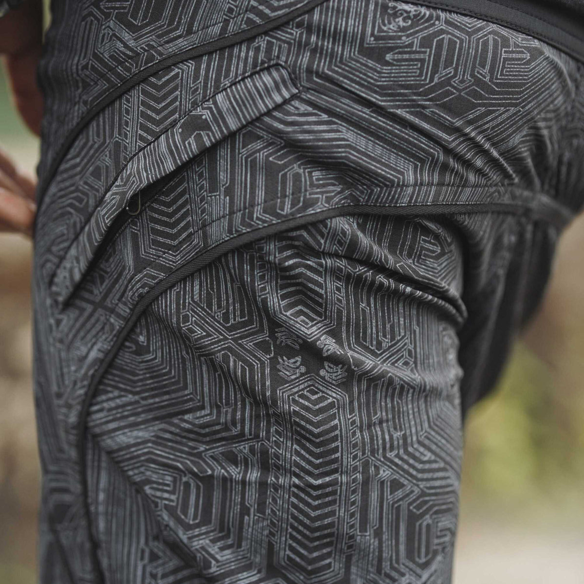 black geometric cyberpunk swim shorts back pocket detail festival shorts design