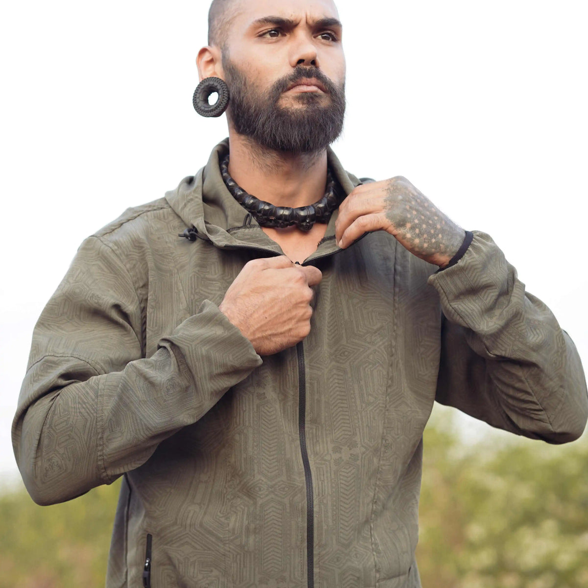 Khaki psychedelic windbreaker jacket with subtle geometric Metanoia print front view