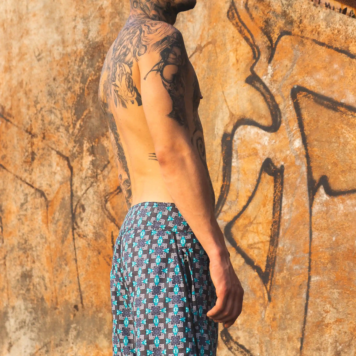 geometric print board shorts men side profile beachwear