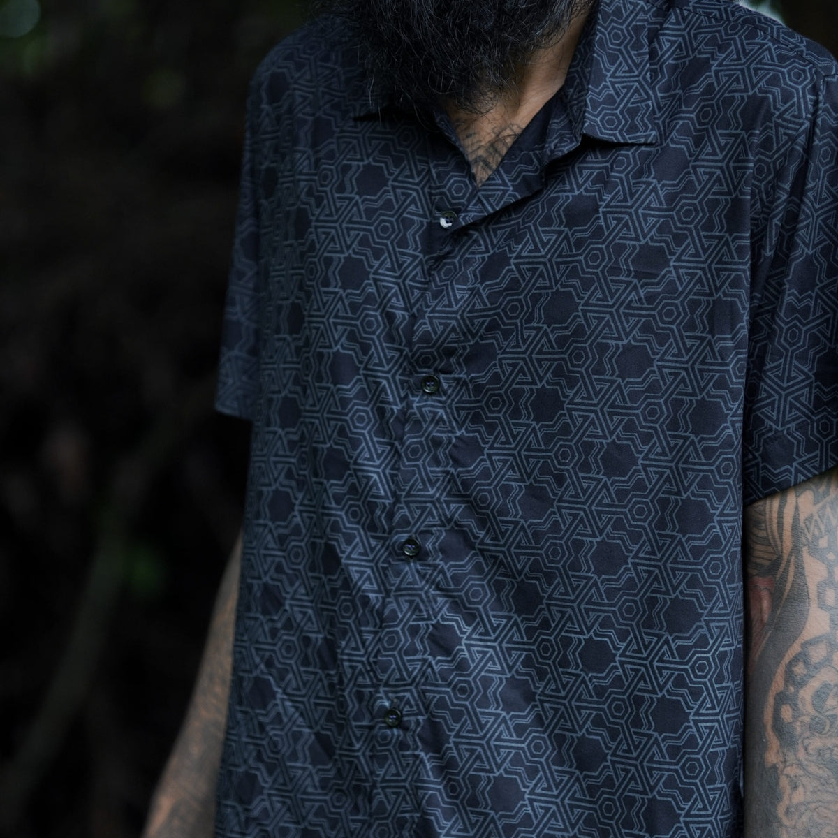 Front view of Pythagoras black men's viscose shirt with geometric sacred geometry pattern