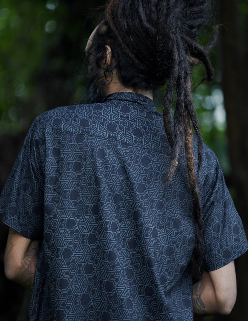 Back view of Pythagoras black men's viscose shirt with all-over sacred geometry artwork