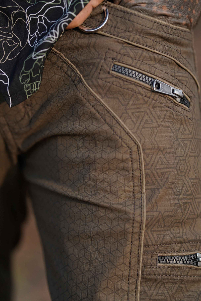 Close-up of durable hardware and brass rivets on cargo street pants