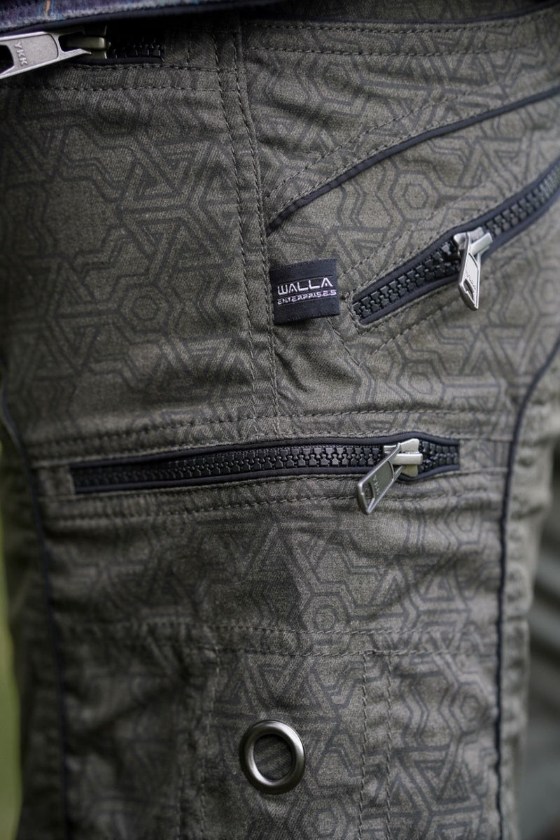 mens green above knee shorts close up YKK zipper detail geometric texture