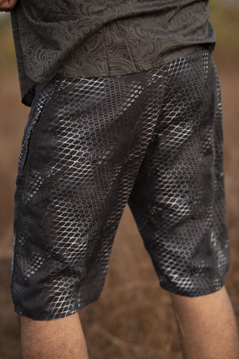 psychedelic python print swim shorts side view textured pattern