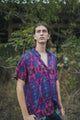 man wearing breathable bamboo shirt for men with psychedelic glitch design
