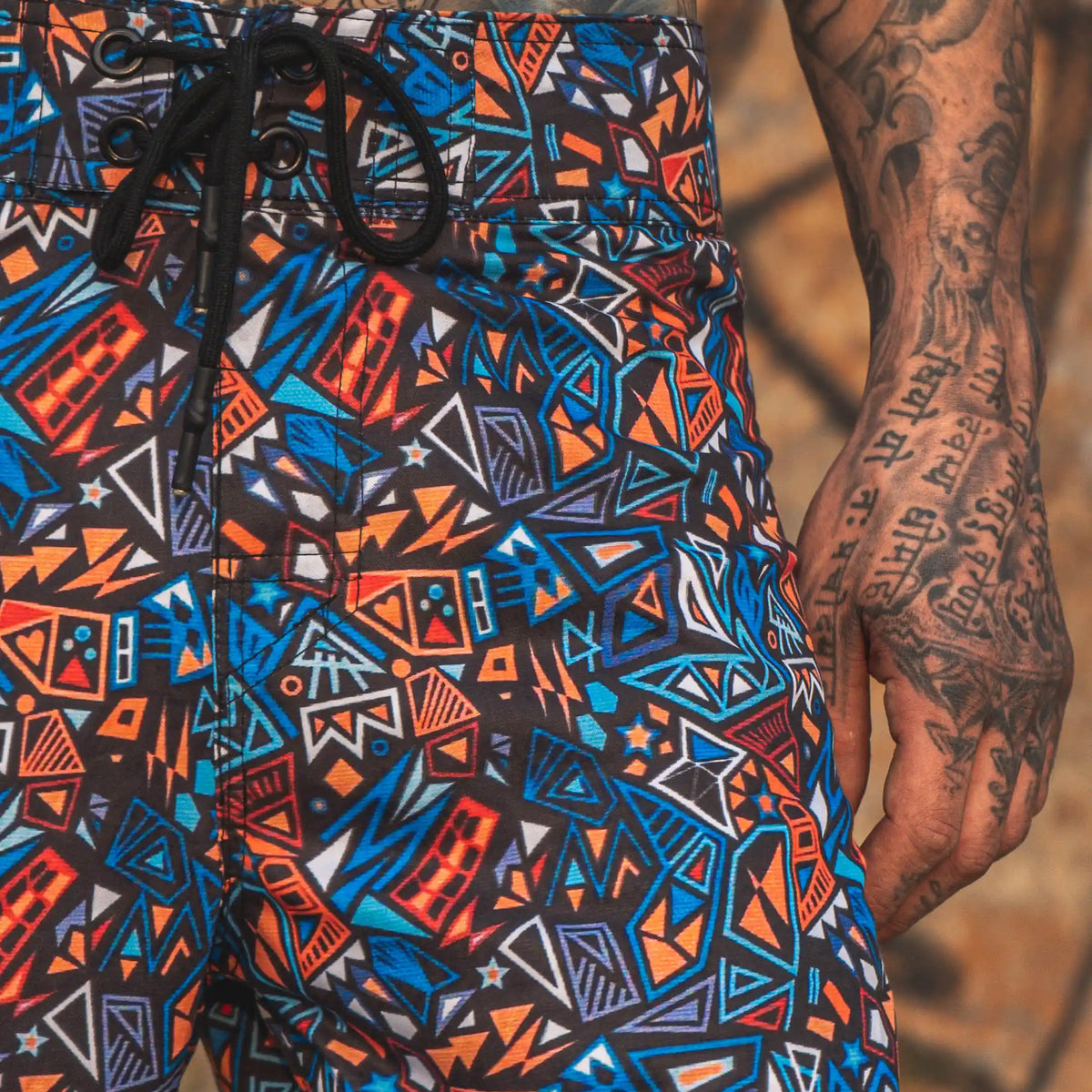 geometric print swim shorts for men colorful psychedelic pattern front view
