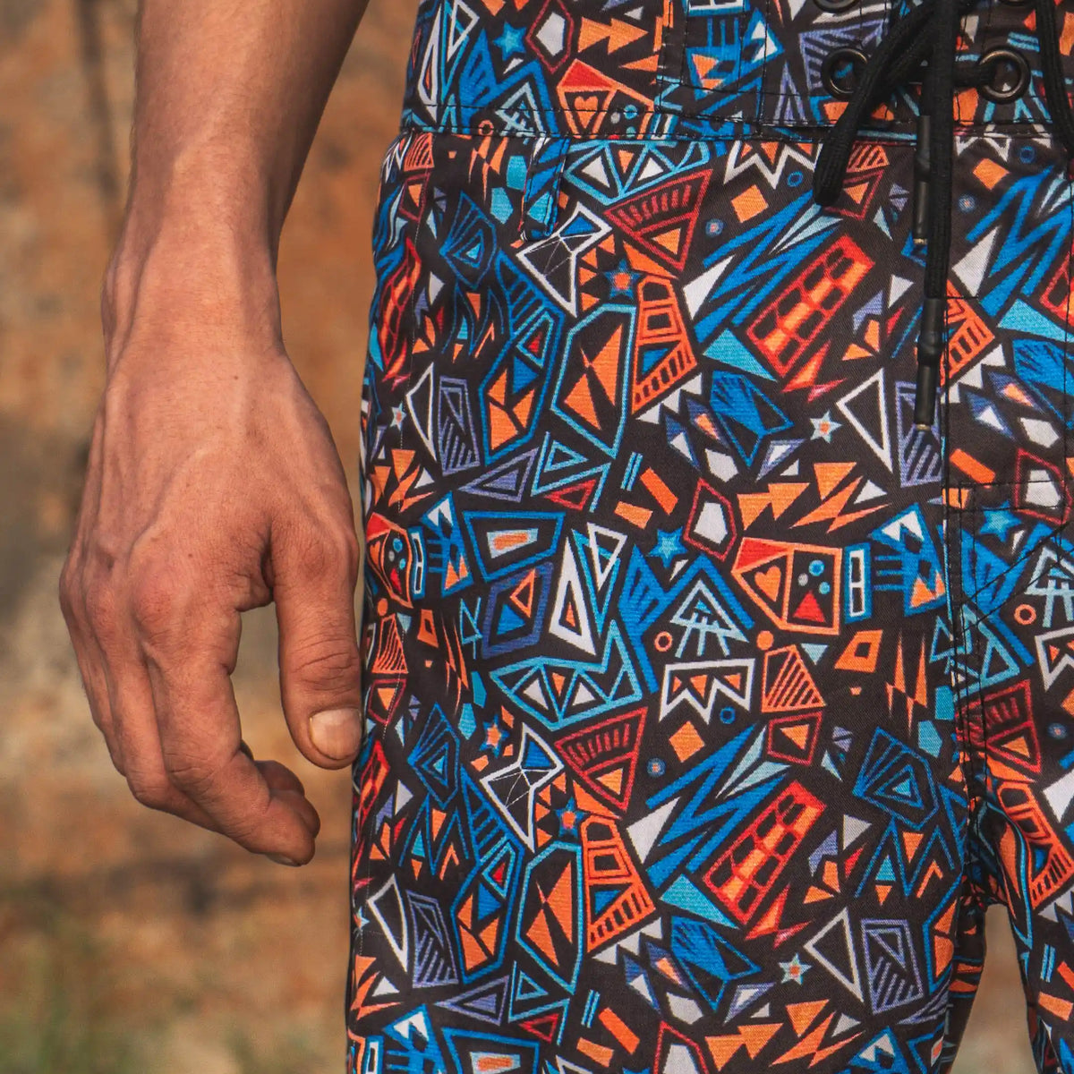 psychedelic geometric swim shorts close up abstract pattern detail