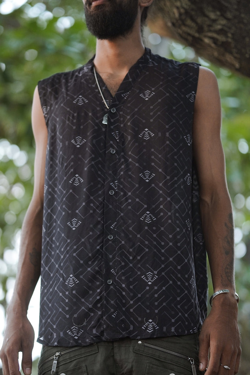 Front view of men wearing bamboo modal sleeveless button-down shirt with minimal geometric psychedelic print