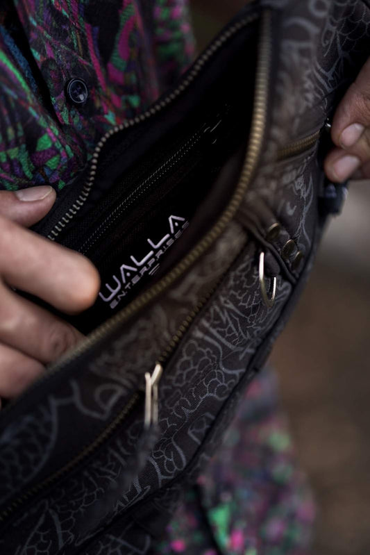 vanta dragon festival sling bag close up zipper pocket