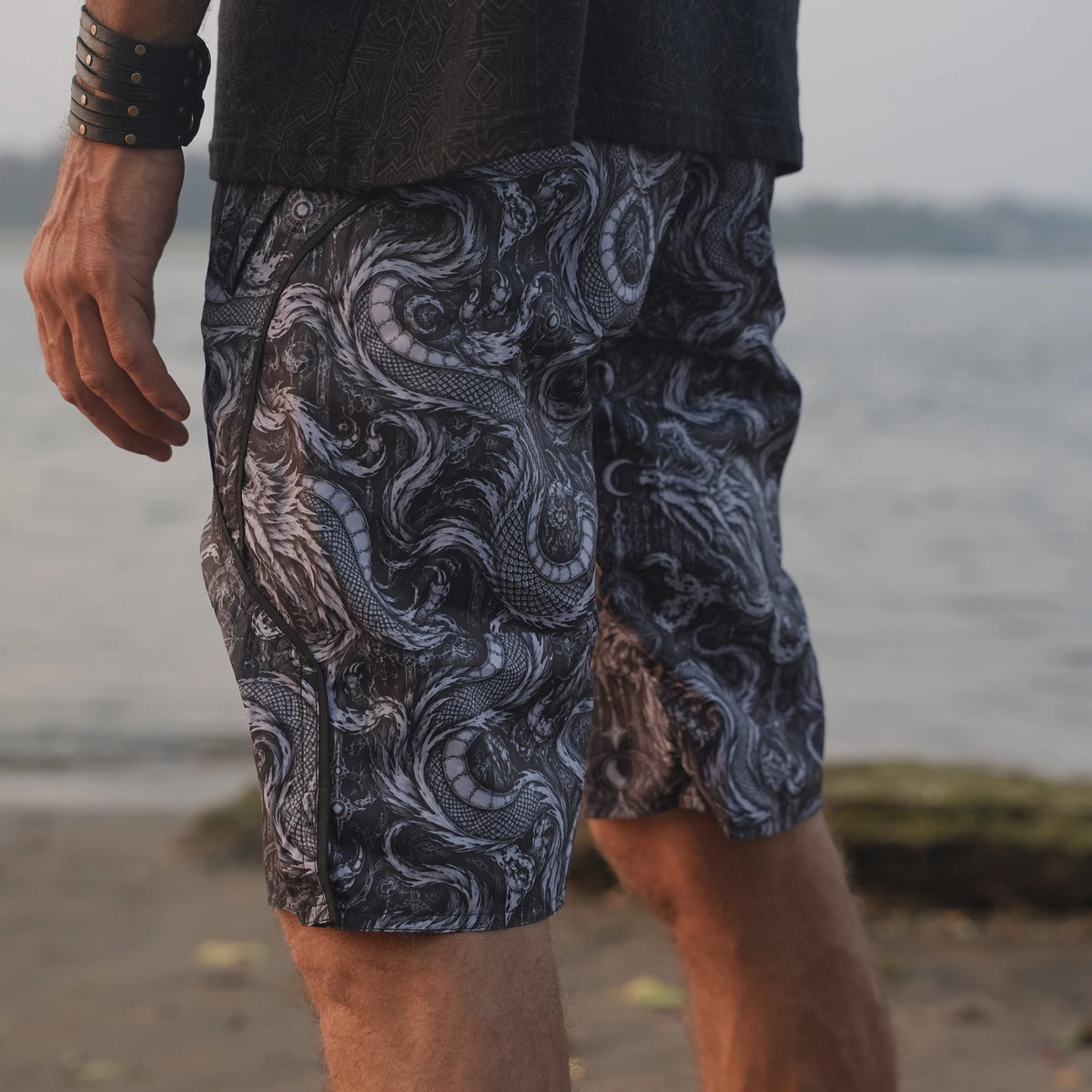 Side view of Abstract Dragon printed board shorts highlighting the detailed dragon artwork, curved black trim and tailored leg shape.
