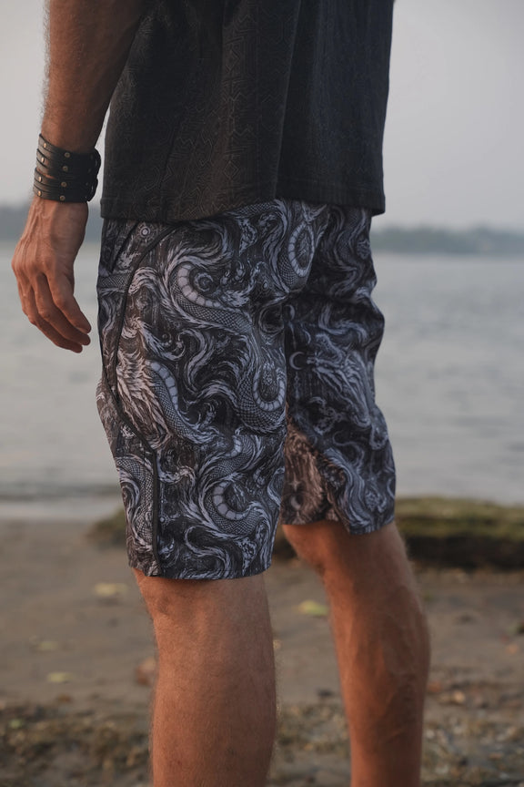 Side view of Abstract Dragon printed board shorts highlighting the detailed dragon artwork, curved black trim and tailored leg shape.
