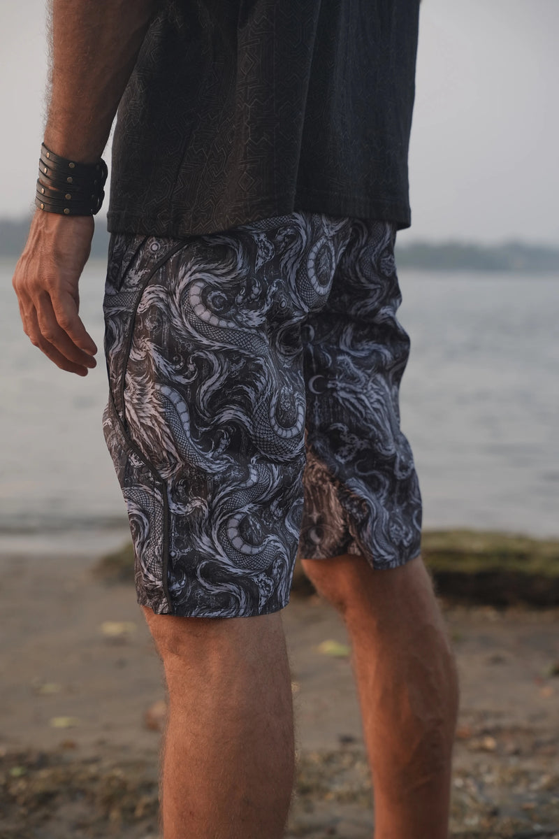 Side view of Abstract Dragon printed board shorts highlighting the detailed dragon artwork, curved black trim and tailored leg shape.
