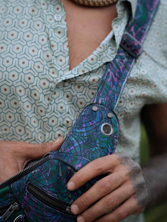 After Burn psychedelic festival crossbody bag close-up showing front zip pocket and adjustable strap