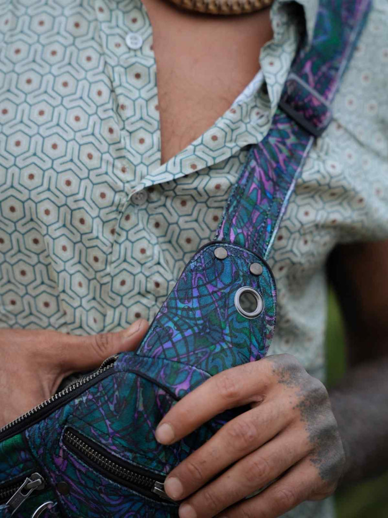 After Burn psychedelic festival crossbody bag close-up showing front zip pocket and adjustable strap