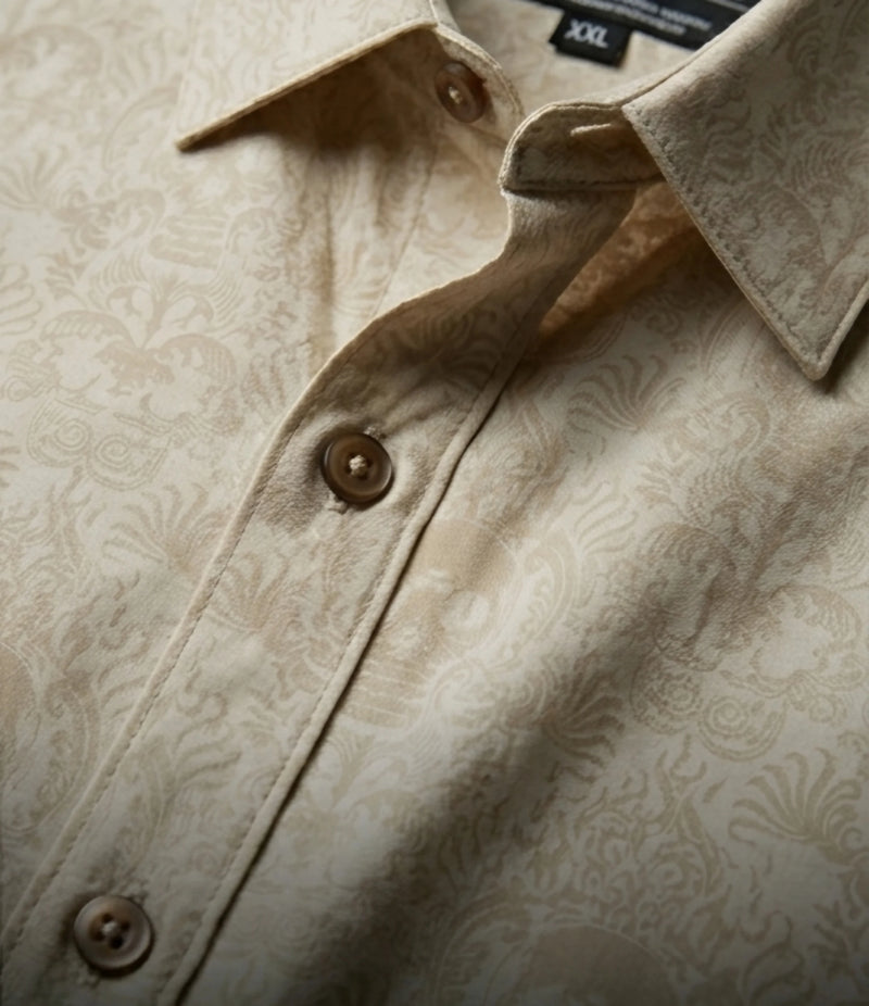 Close-up of beige Cancun Skull viscose button down shirt featuring intricate ornamental print