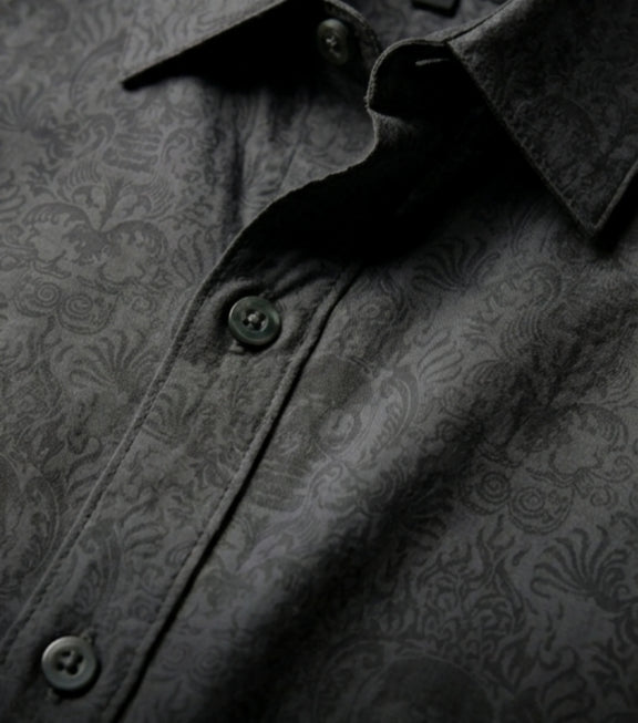 Close-up of black Cancun Skull viscose button down shirt with tonal skull pattern