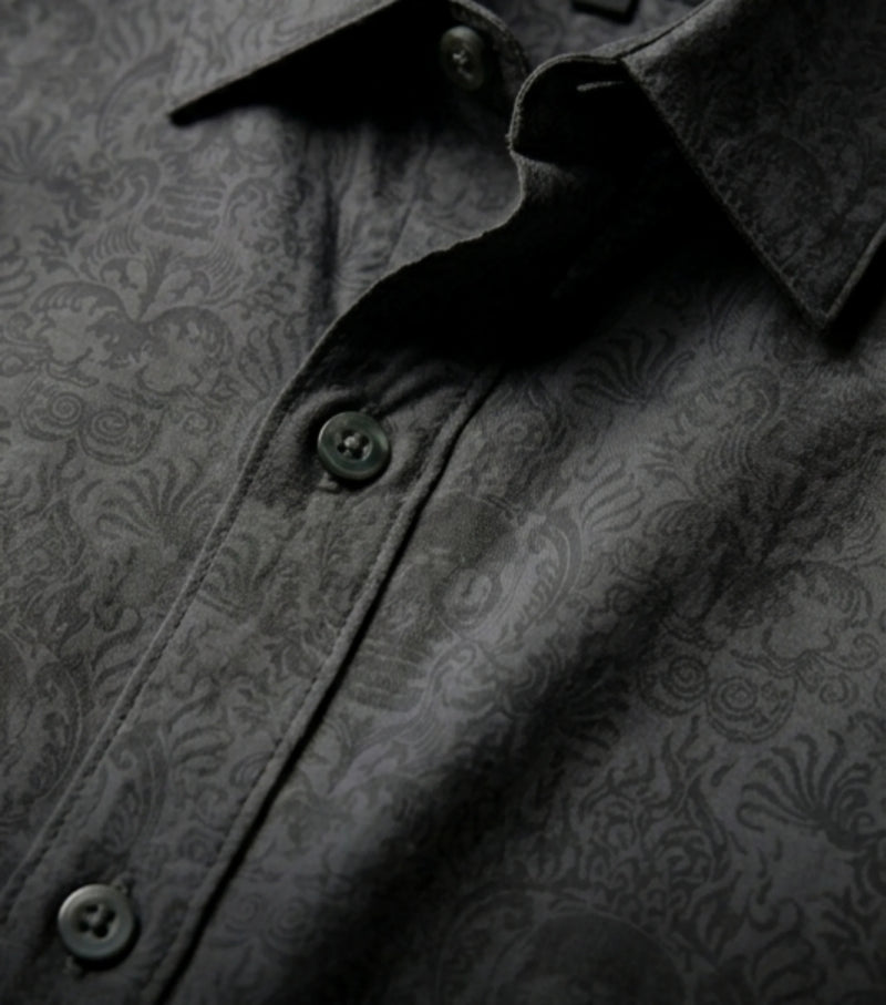 Close-up of black Cancun Skull viscose button down shirt with tonal skull pattern