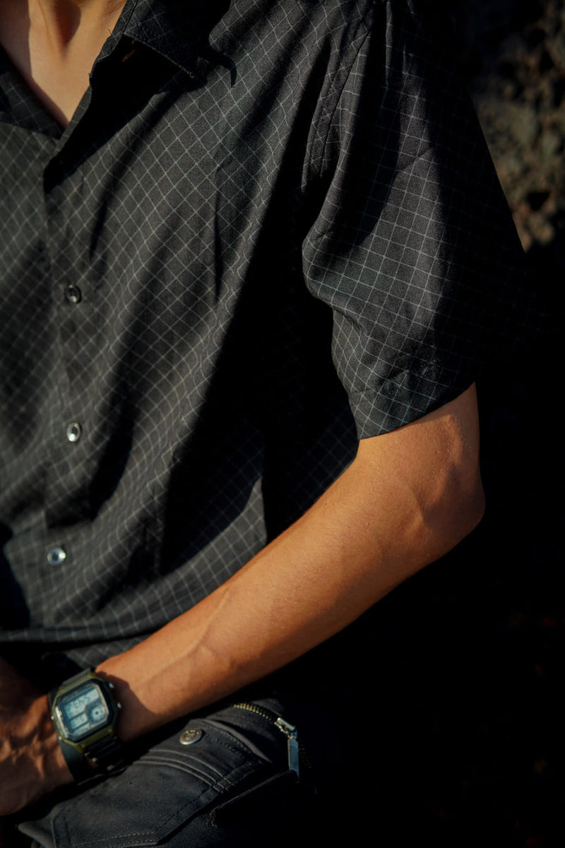 Black VAAYU viscose button down shirt featuring a subtle geometric grid print