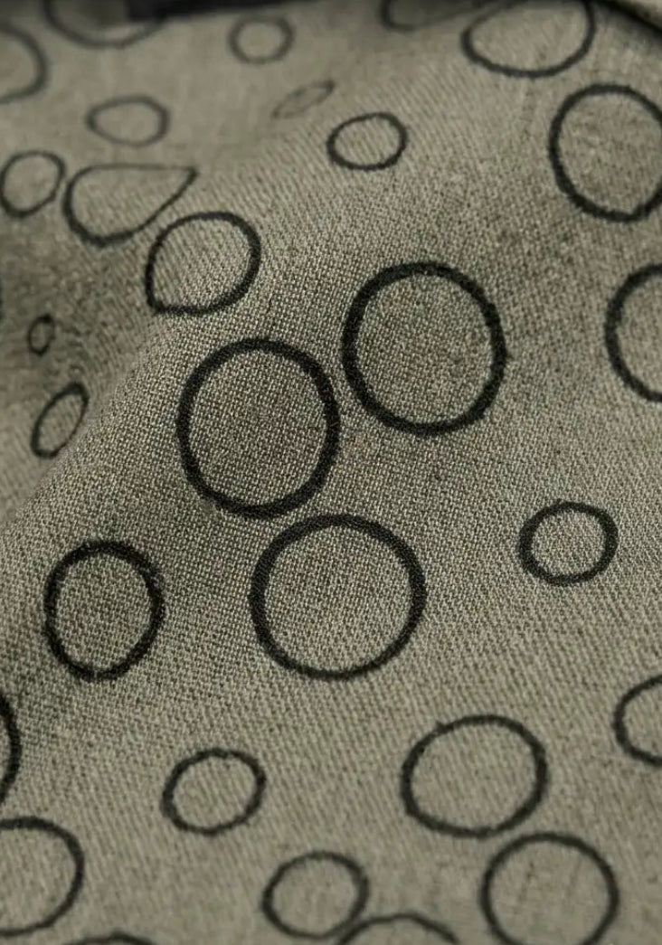 Close Fabric Details of Bubble Trouble khaki men's viscose shirt featuring modern geometric circle print 
