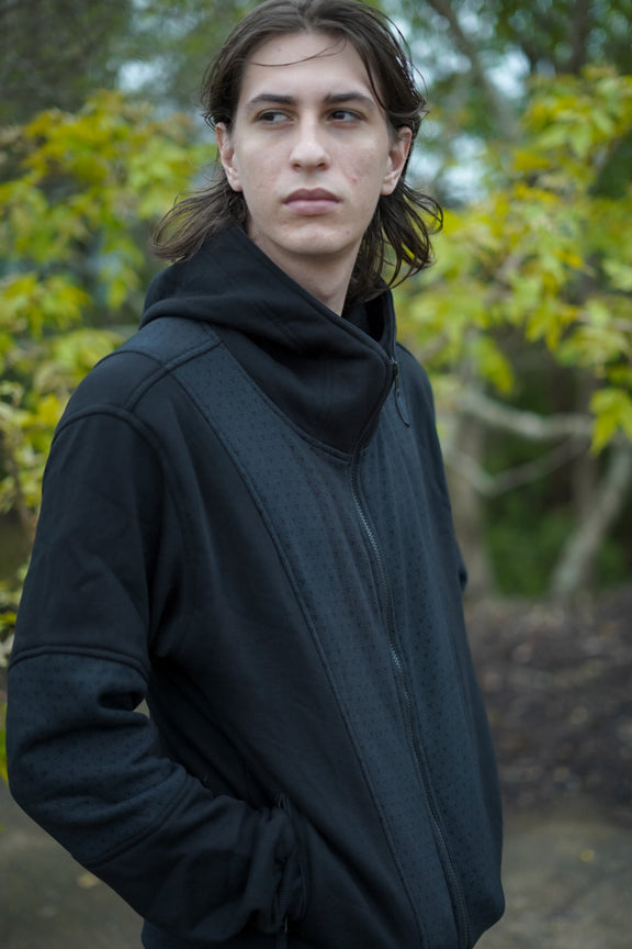 Side and back view of the Clover Vortex hoodie showing the patterned back panel