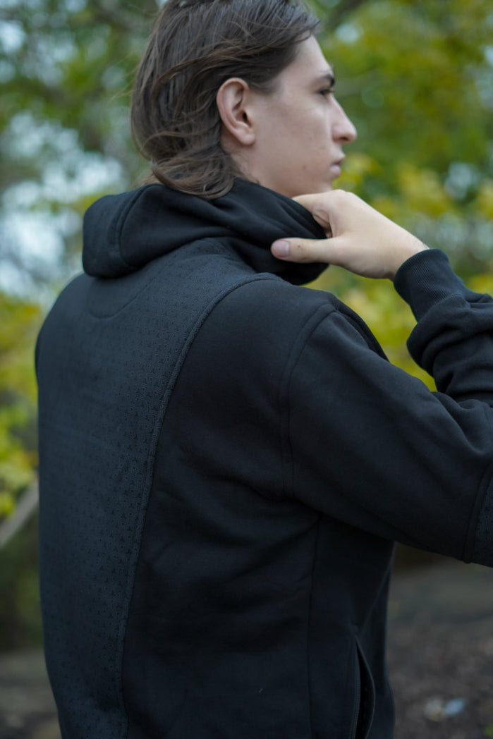 Rear view of the Clover Vortex hoodie highlighting its patterned back panel