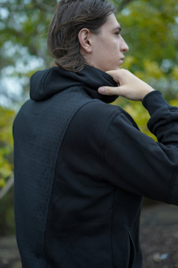 Rear view of the Clover Vortex hoodie highlighting its patterned back panel