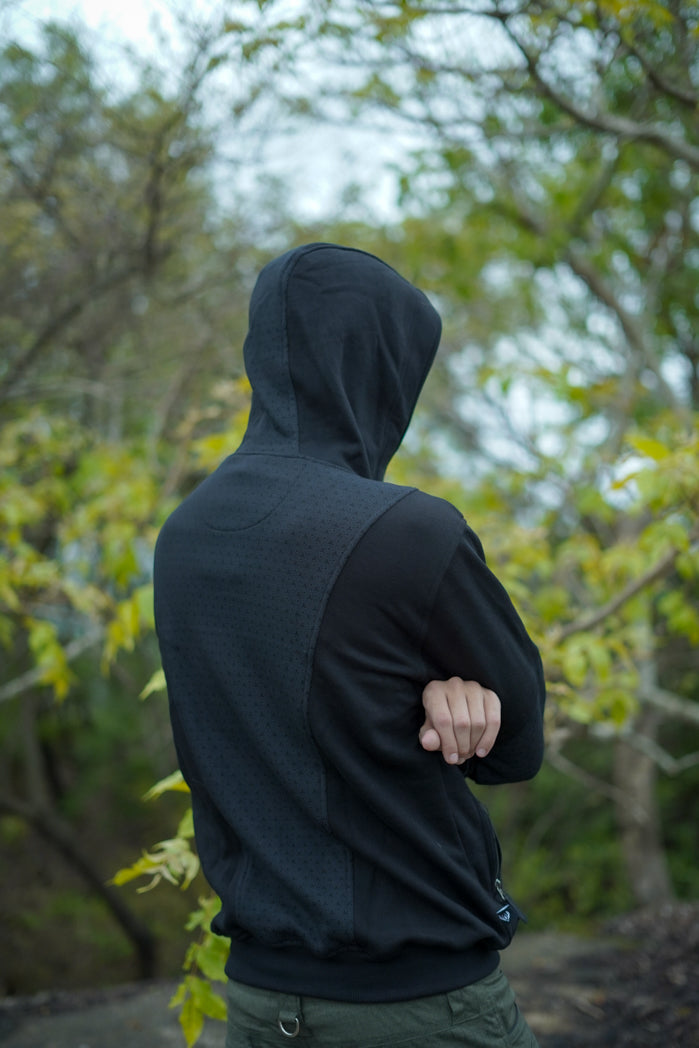 Clover Vortex hoodie viewed from the back and side, showing the hood and patterned panels