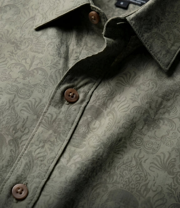 Close-up of khaki Cancun Skull viscose button down shirt showing premium printed fabric