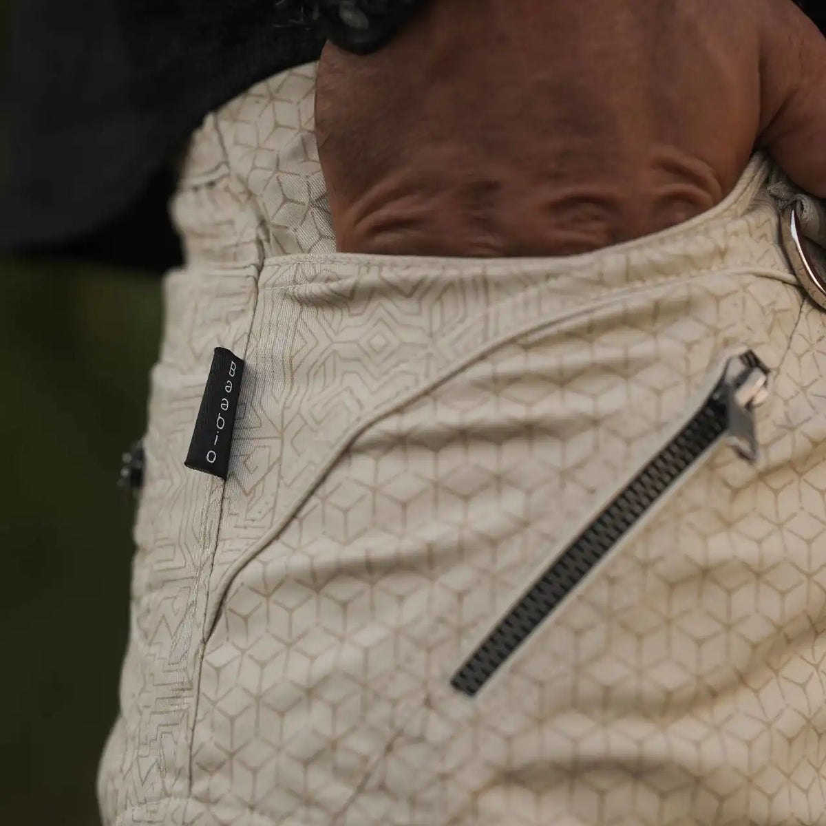 Men's beige geometric cargo pants with zipper pockets