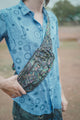 Mind Flare psychedelic festival crossbody bag worn over the shoulder