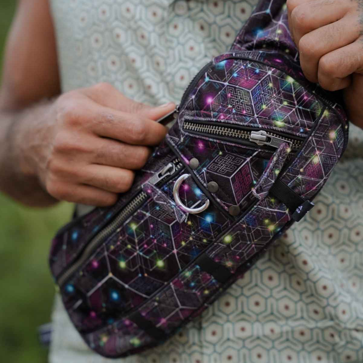 NEUROSOMATIC psychedelic crossbody bag with multiple zippered compartments